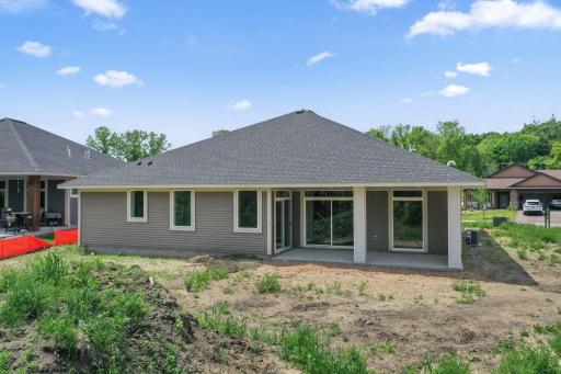 Private back covered porch overlooking pond and trees