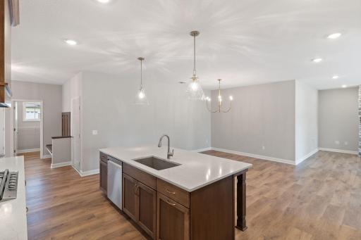 Stained center island with white enamel perimeter cabinets