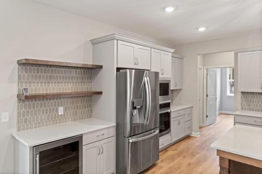 Stainless steel appliances and coffee bar with beverage frig