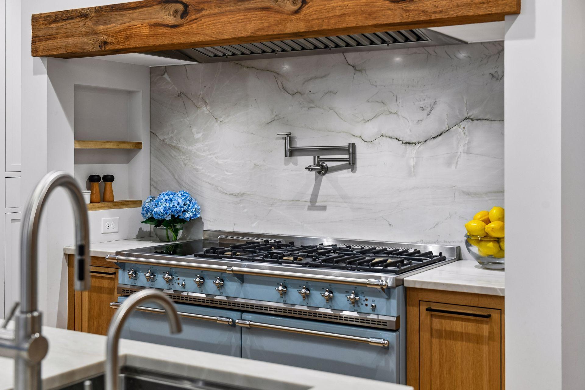 The range is similarly well supported by Rev-a-shelf utensil and spice organization within pull out cabinets. Inset shelving and a pot filler puts everything within arms reach.