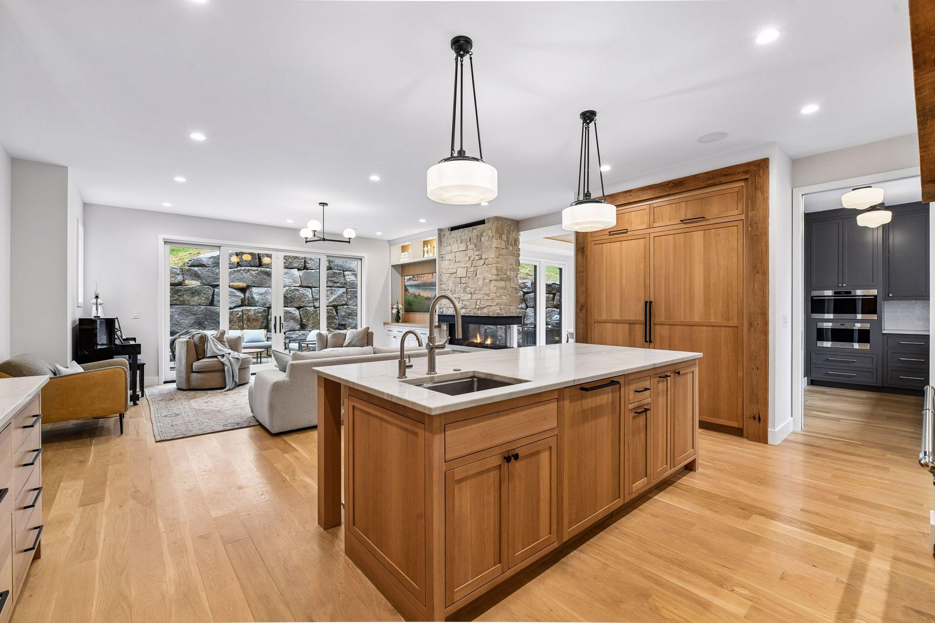 In island sink for prep work filled with standard and Revere osmosis faucets. In sink disposal system makes clean up efficient.