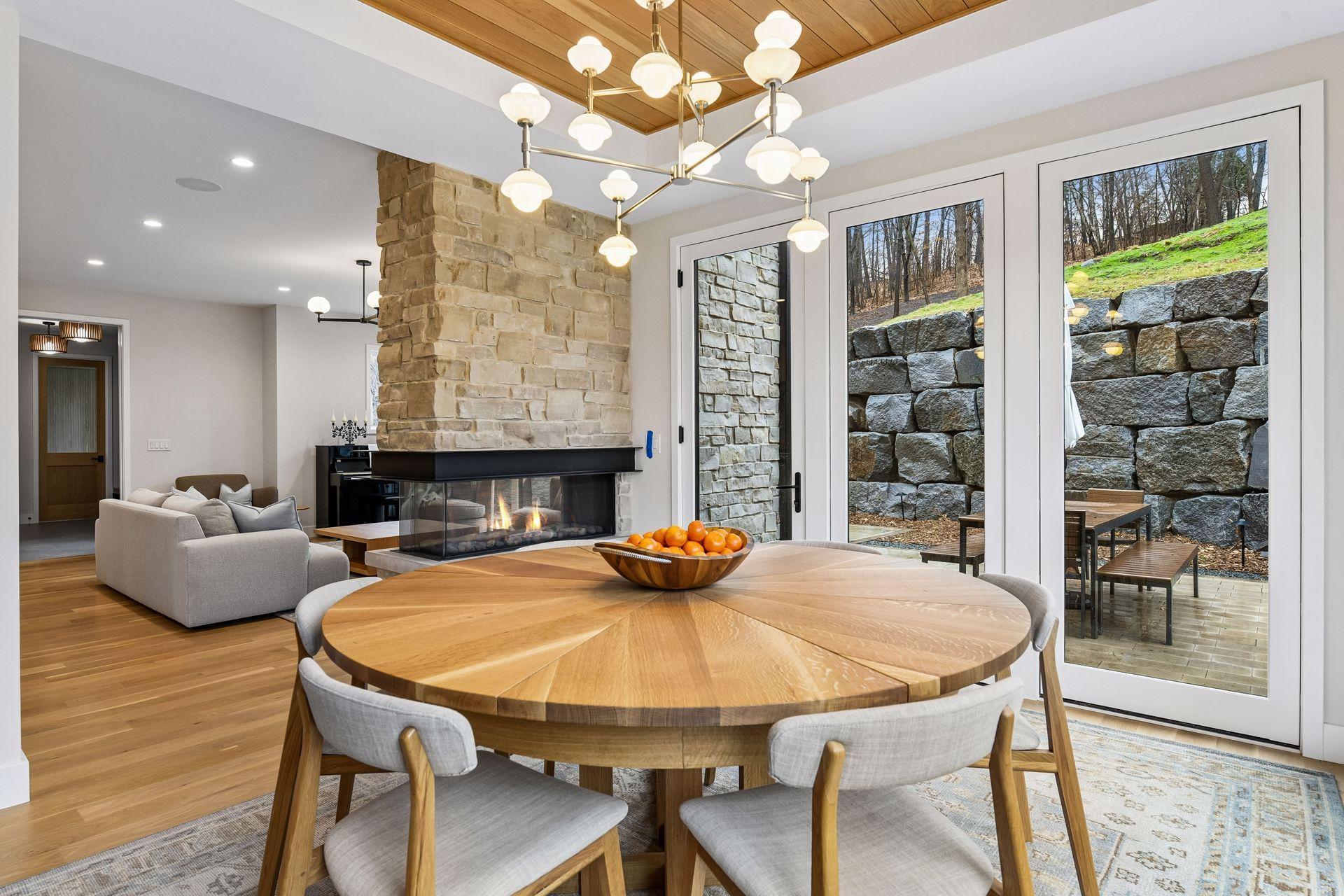 The door off the dining room exists to the outdoor dining room fitted with a built in natural gas line for grilling.