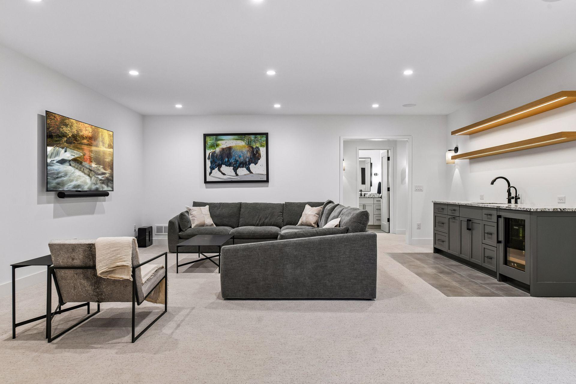 A built in wet bar with beverage refrigerator with natural stone and custom cabinetry and shelving electrified for easy visualization.
