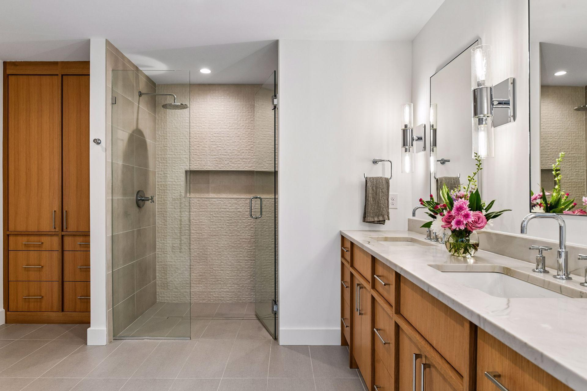 Double sink and make up vanity fitted with in cabinet electrified hair tool pull out.