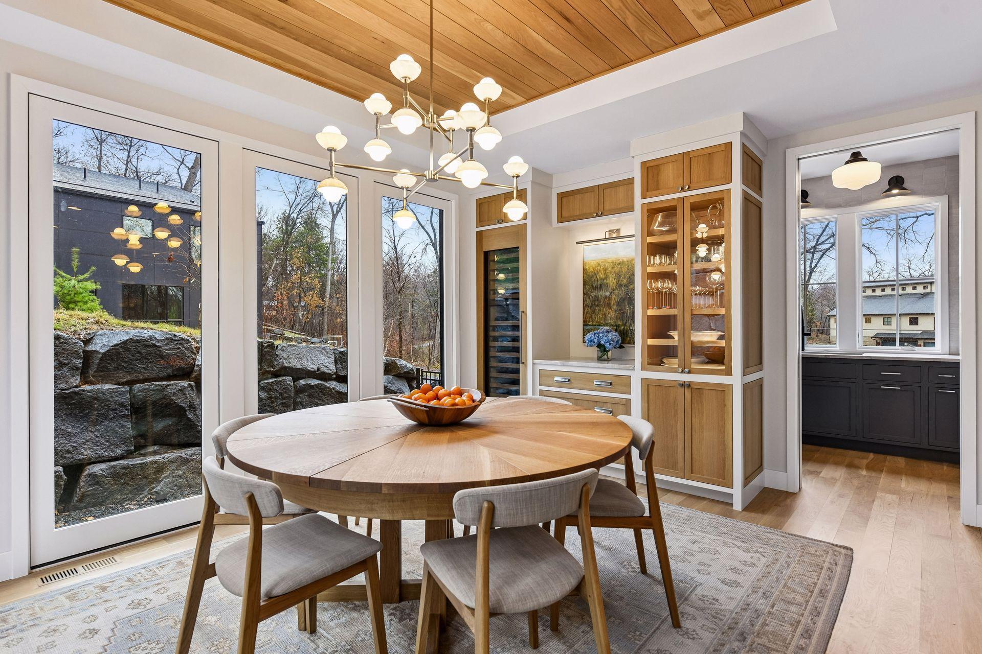 Sub-zero wine fridge with two separate tempterature zones accompanies plentiful storage for bar wares and table linens.