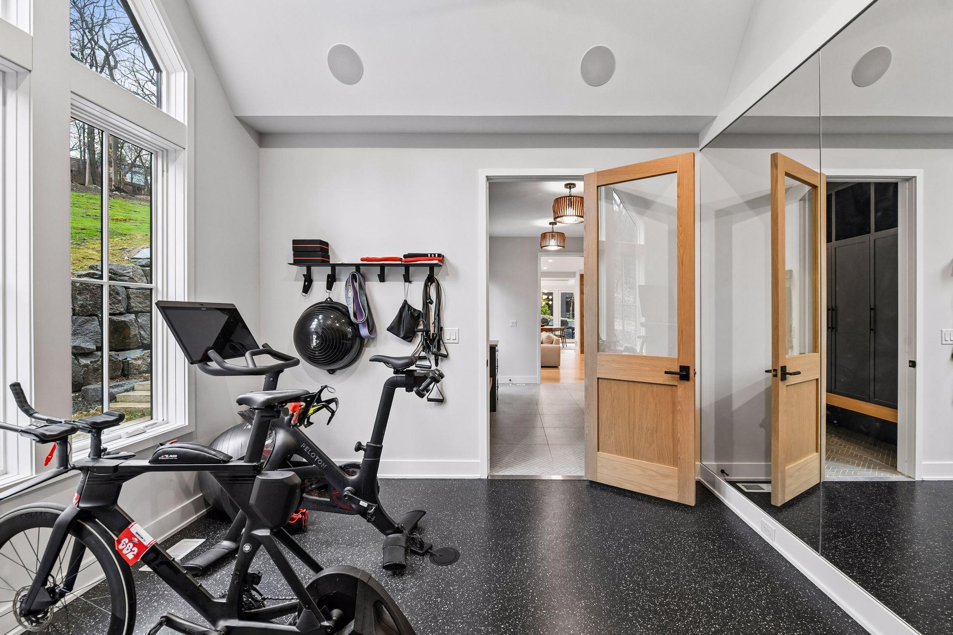 Industrial fan in the gym keeps you cool while listening to music via in ceiling sonos but the rest of the house remains quiet.