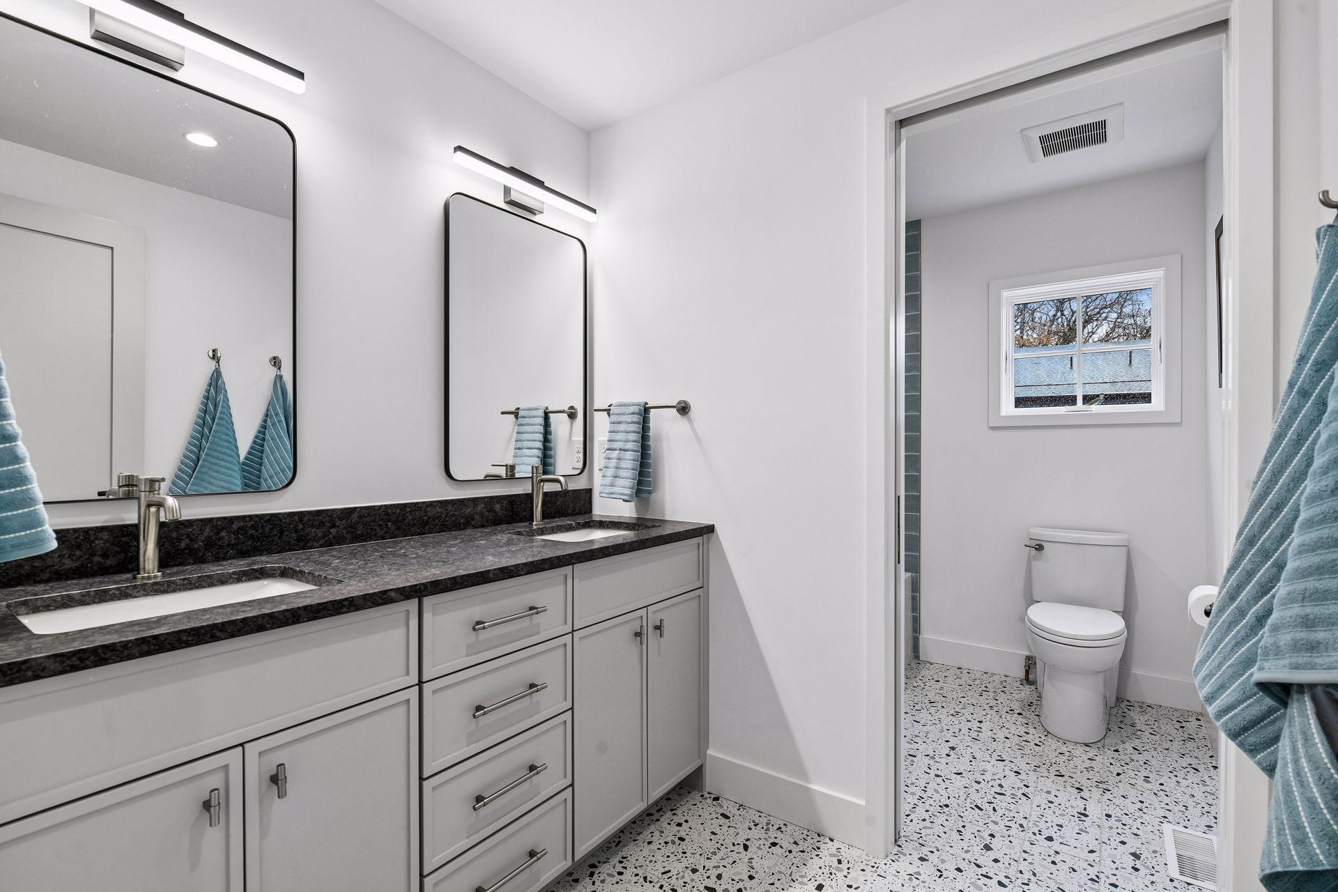 Double vanity with bathtub and shower combo.