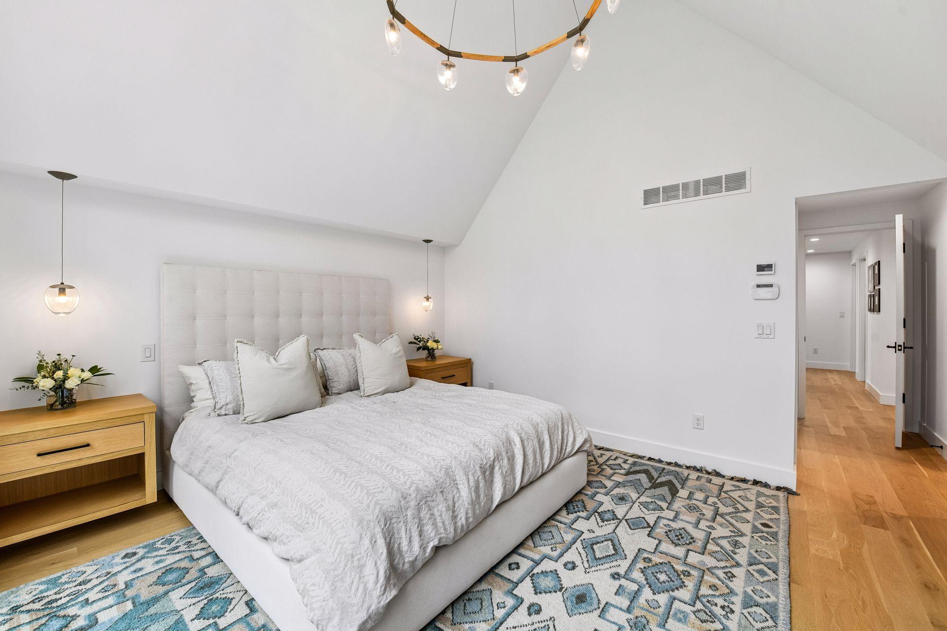 The custom made built in bedside tables keep clutter off the ground.