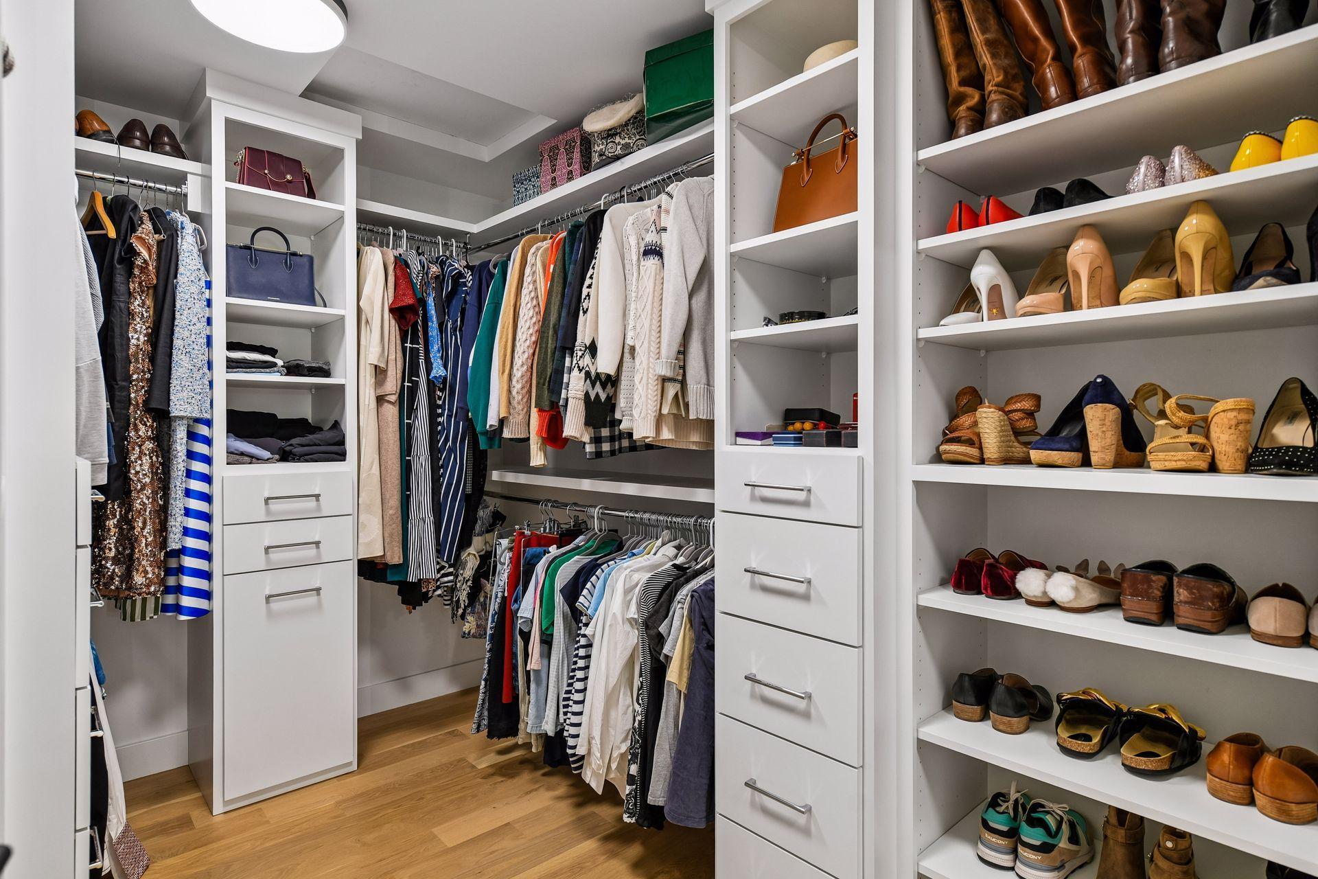 Floor to ceiling organization built by Century custom cabinets. Features include concealed laundry hamper and jewelry drawer.