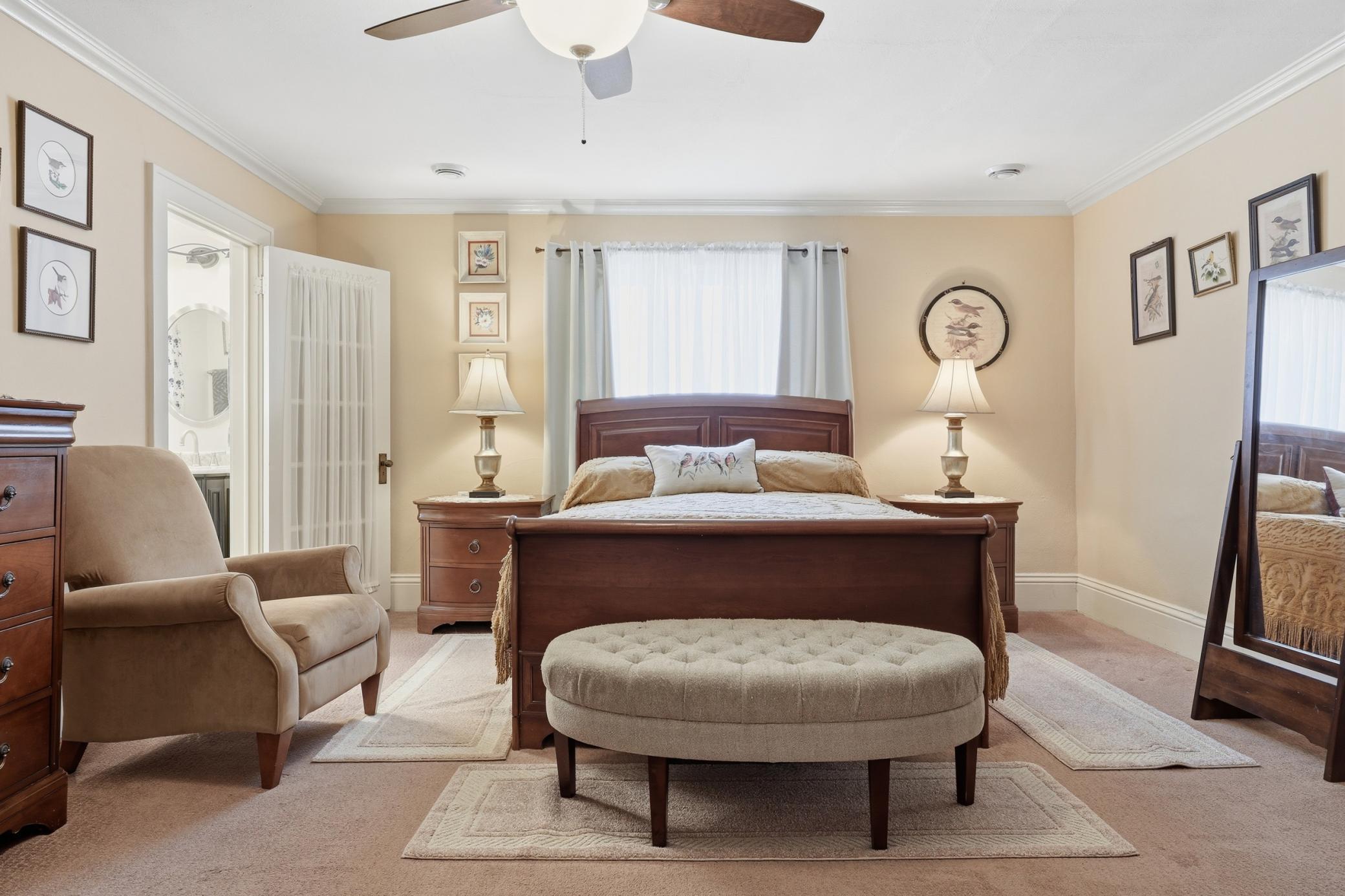 Upper level primary bedroom with 3/4 en-suite bathroom.