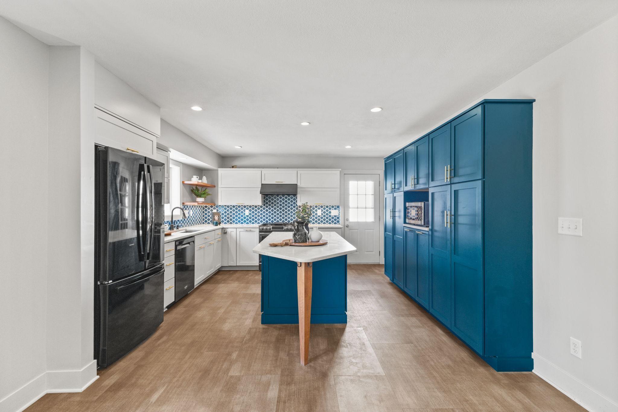 Open kitchen with center island and functional, modern layout