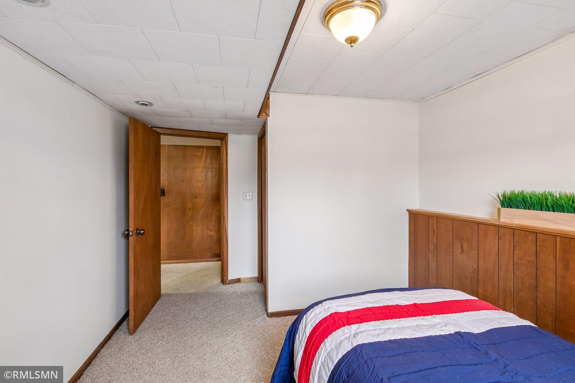 Just a few steps up from this lower level bedroom to the main floor