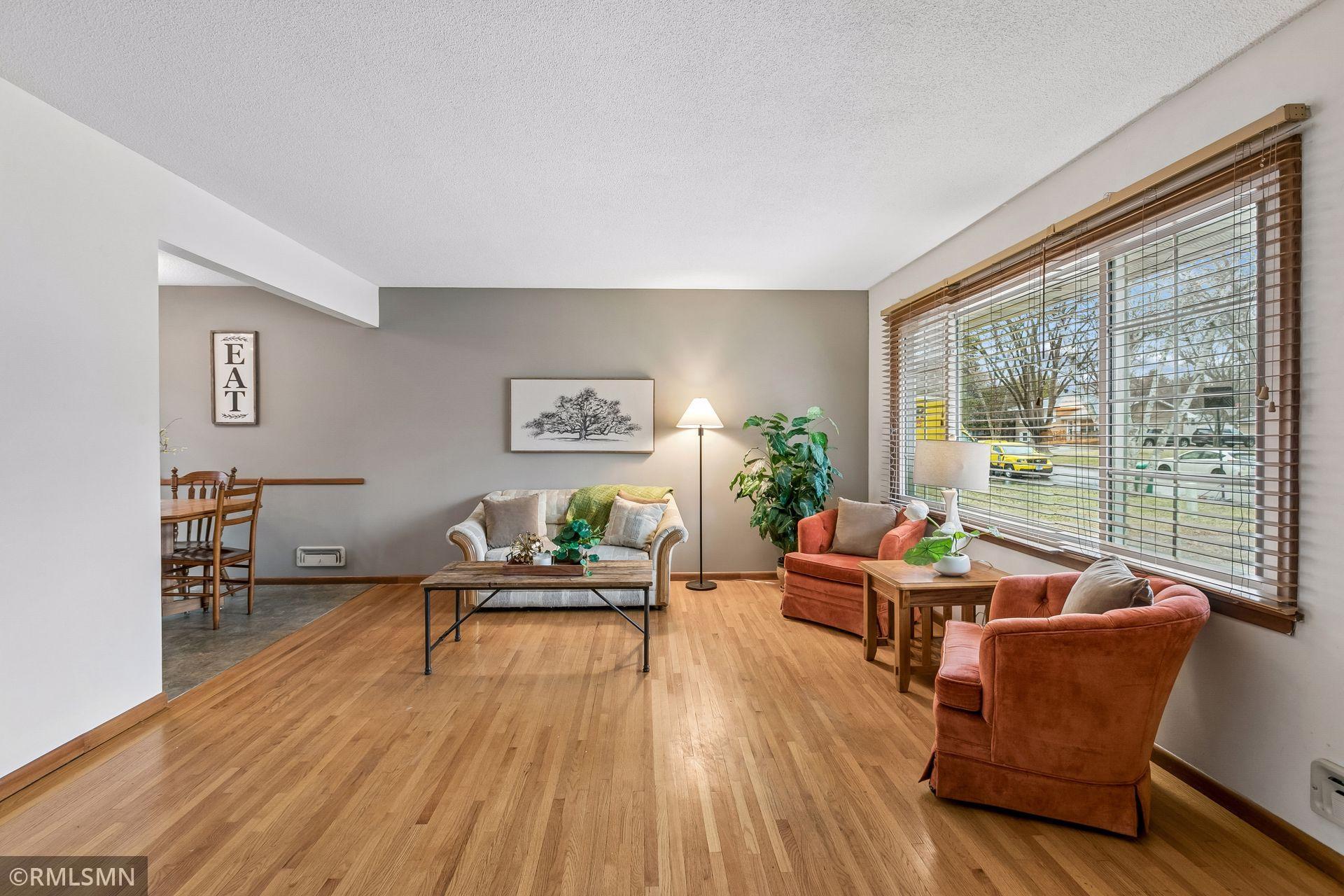 Cozy & comfortable living room flows into the kitchen/ informal dining room