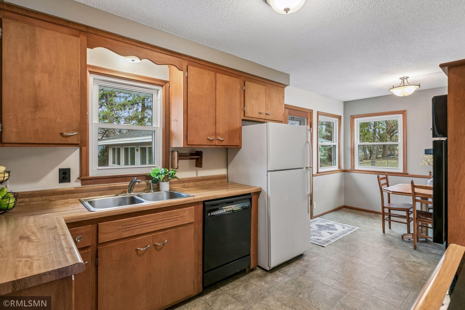 Approximately half of the windows in tKitchen window overlooking the private and expansive backyard!