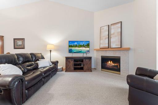 Living room with gas fireplace and vaulted ceilings