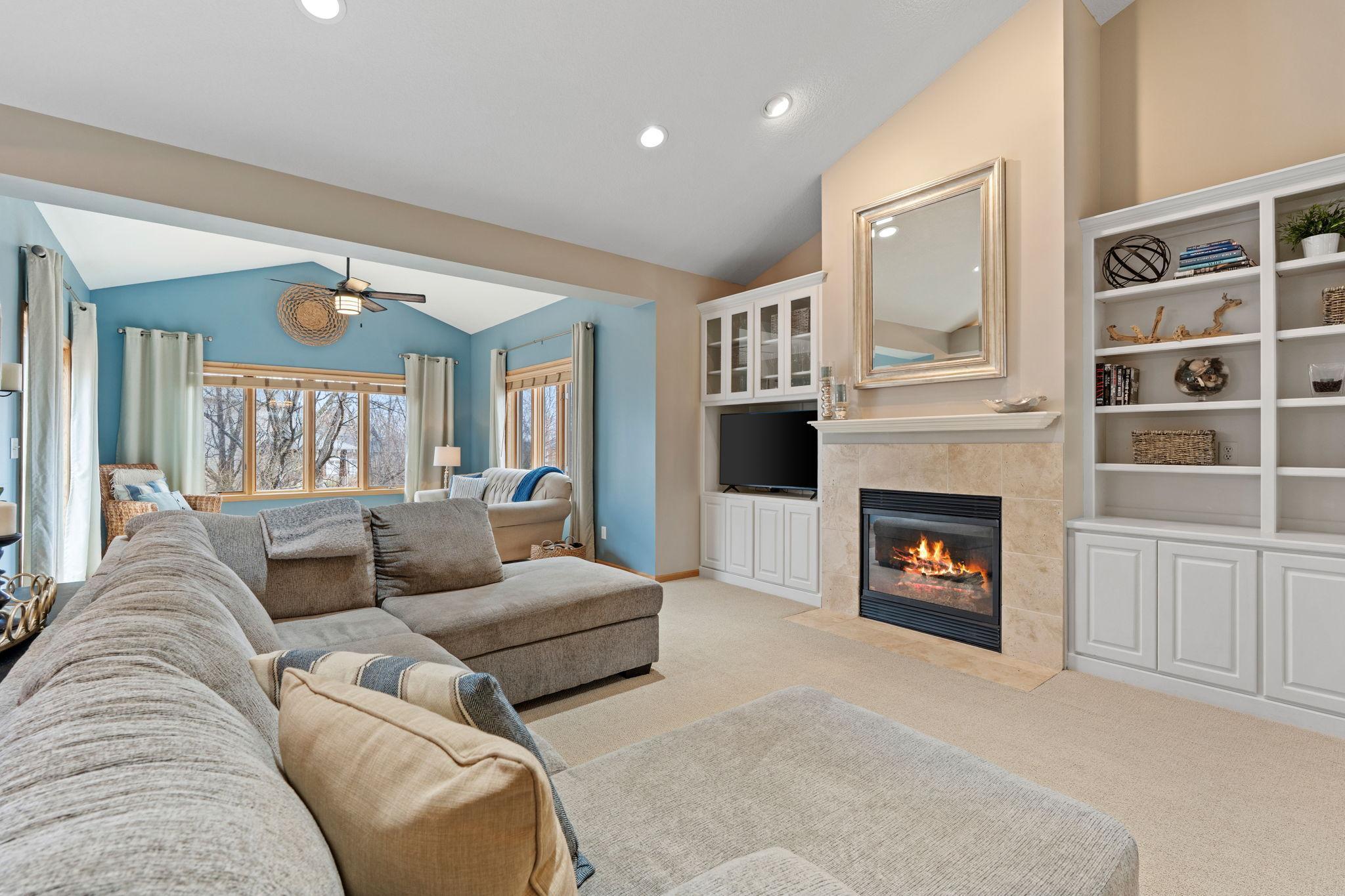 Enjoy Vaulted Ceilings, Built In Shelving and the 1st of 2 Fireplaces