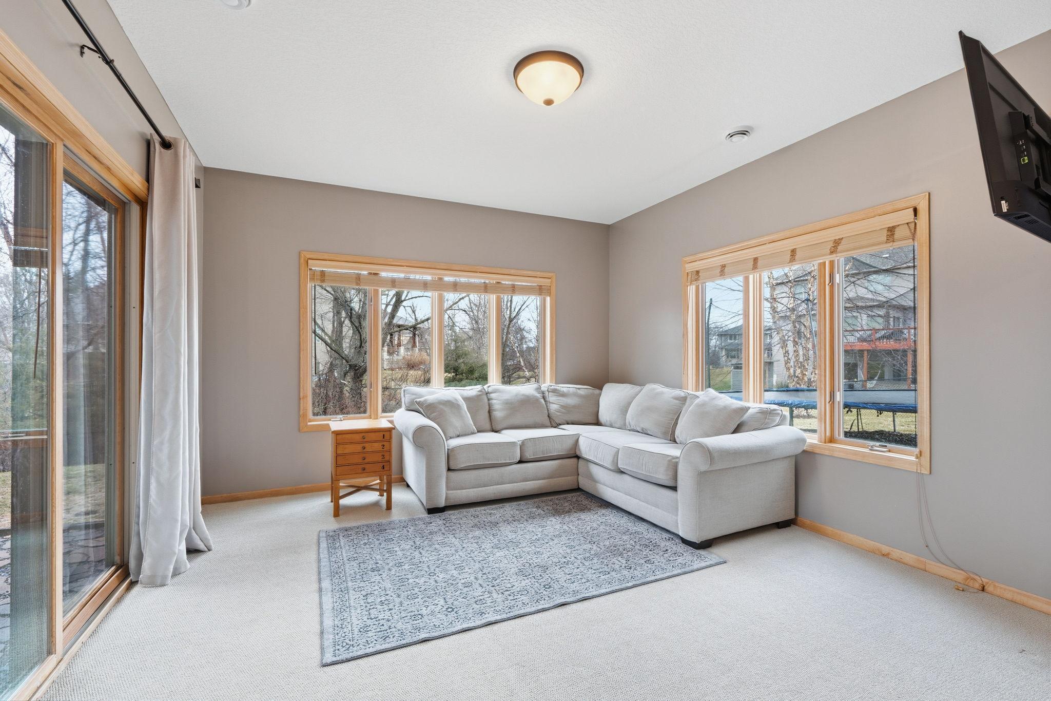 Den that walks out to the Hot Tub and Back Yard