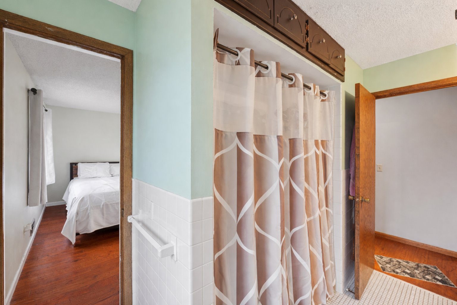 Bright bathroom with a bedroom view.png