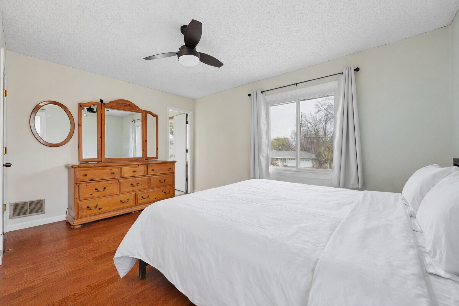 Serene bedroom with natural light.png