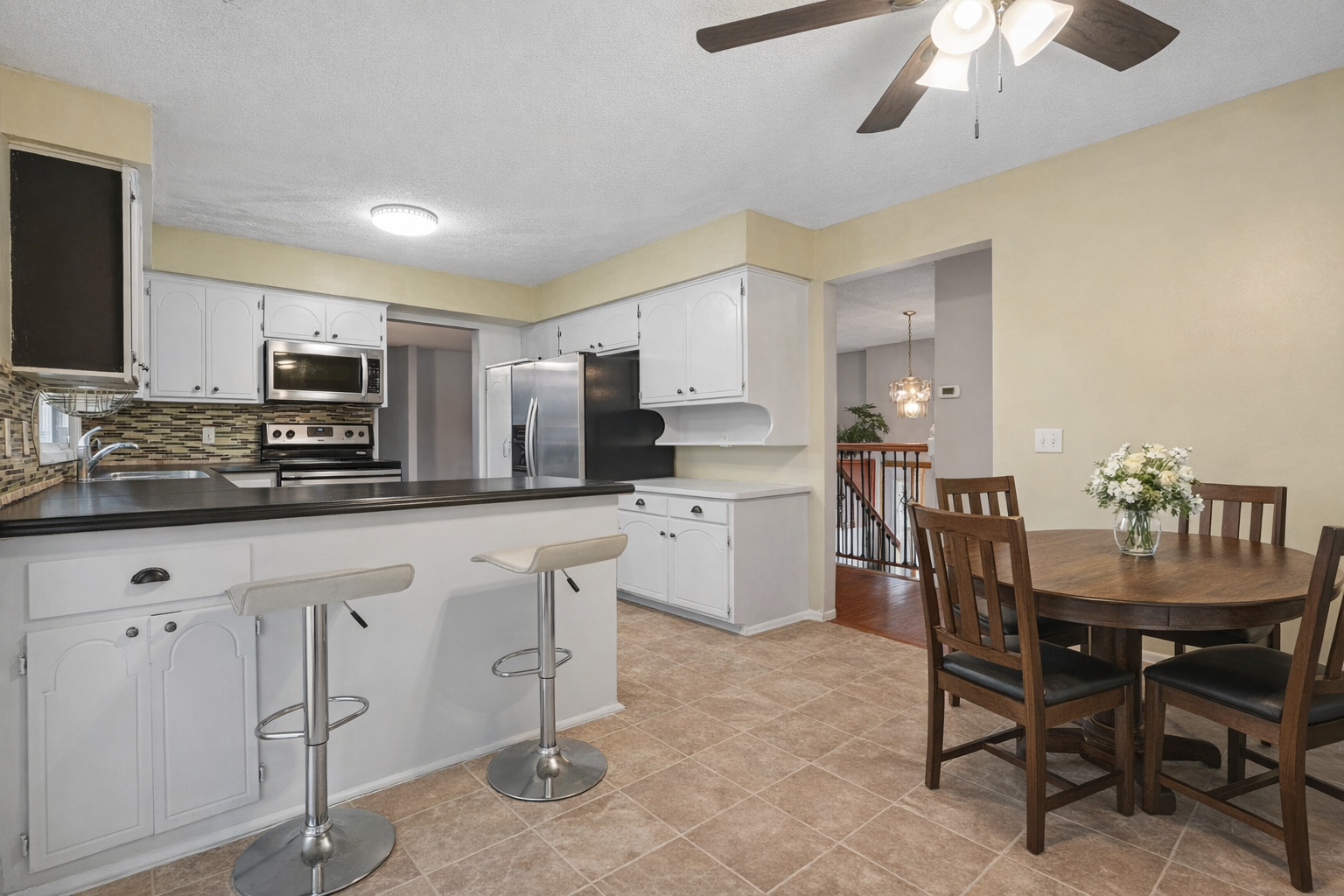 Modern kitchen and dining area setup.png