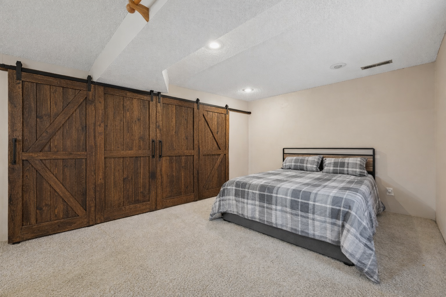 Lower level BR with AI sliding barn door
