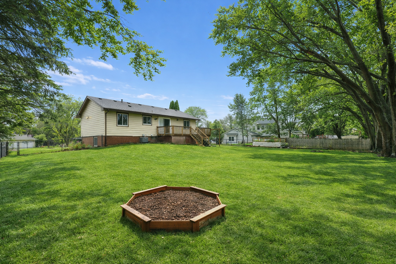 Suburban backyard with lush garden bed.png