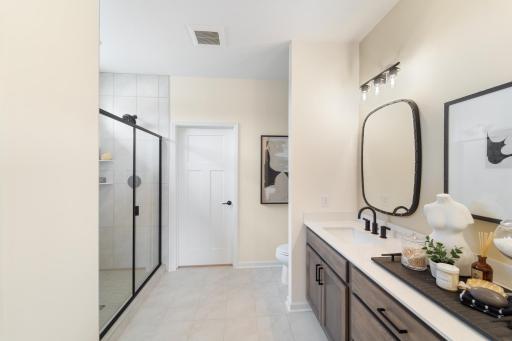 Owner's Bathroom features an oversized and ceramic tiled shower.