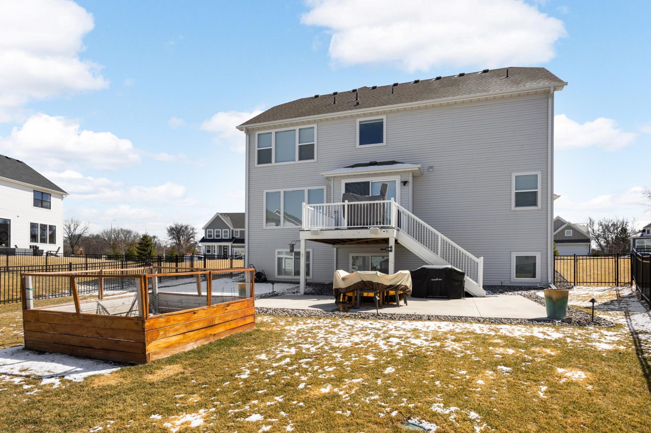 Backyard - complete with maintenance free deck, large patio and raised garden