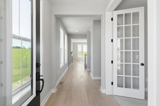 Gorgeous oak floors and lots of windows greet you at entrance to home (photo of actual listing).
