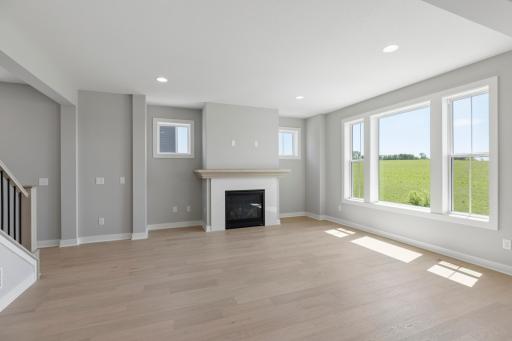 Main floor gathering room features loads of light from southern exposure (photo of actual listing).