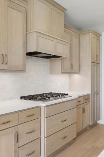 36" gas cooktop with vented range hood (photo of actual listing).
