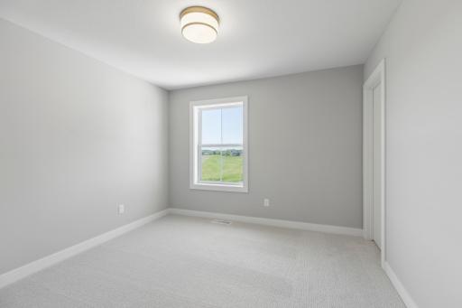 One of four bedrooms (photo of actual listing).