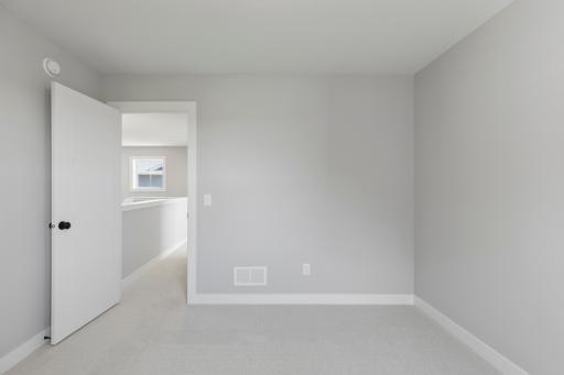 One of four bedrooms (photo of actual listing).
