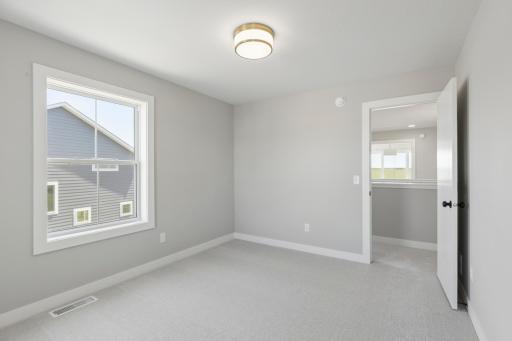 One of four bedrooms (photo of actual listing).