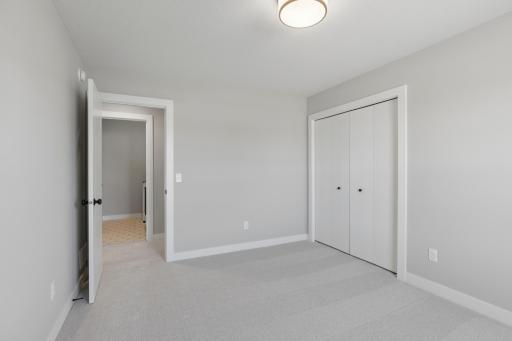 One of four bedrooms (photo of actual listing).
