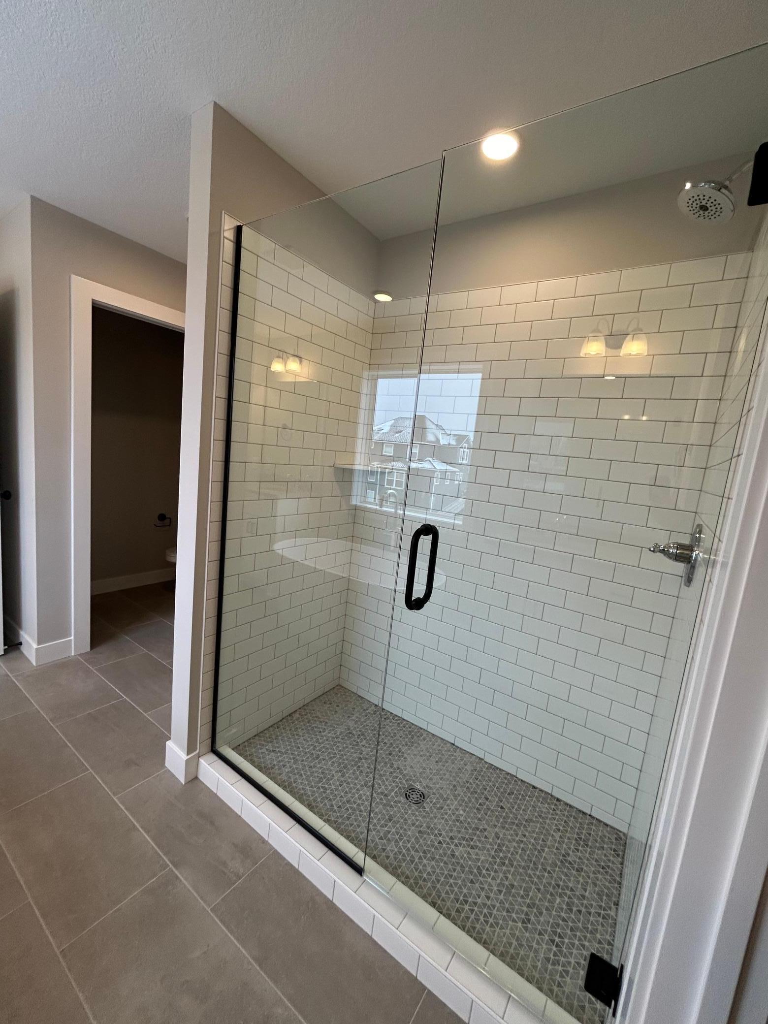 Large Tiled Shower In Owner's Bath