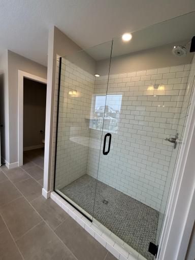 Large Tiled Shower In Owner's Bath