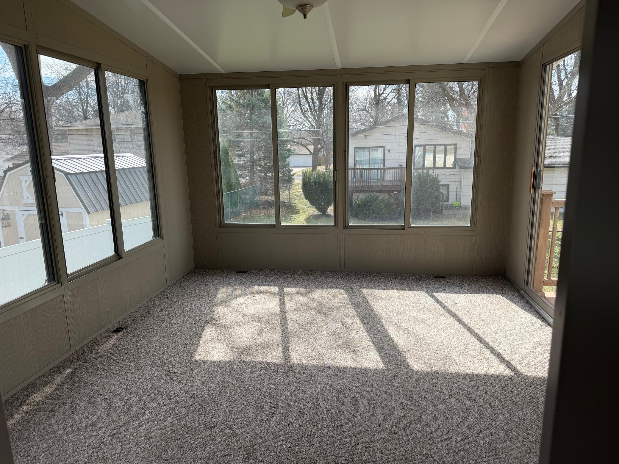 3-Season Porch has vaulted ceiling and huge windows.