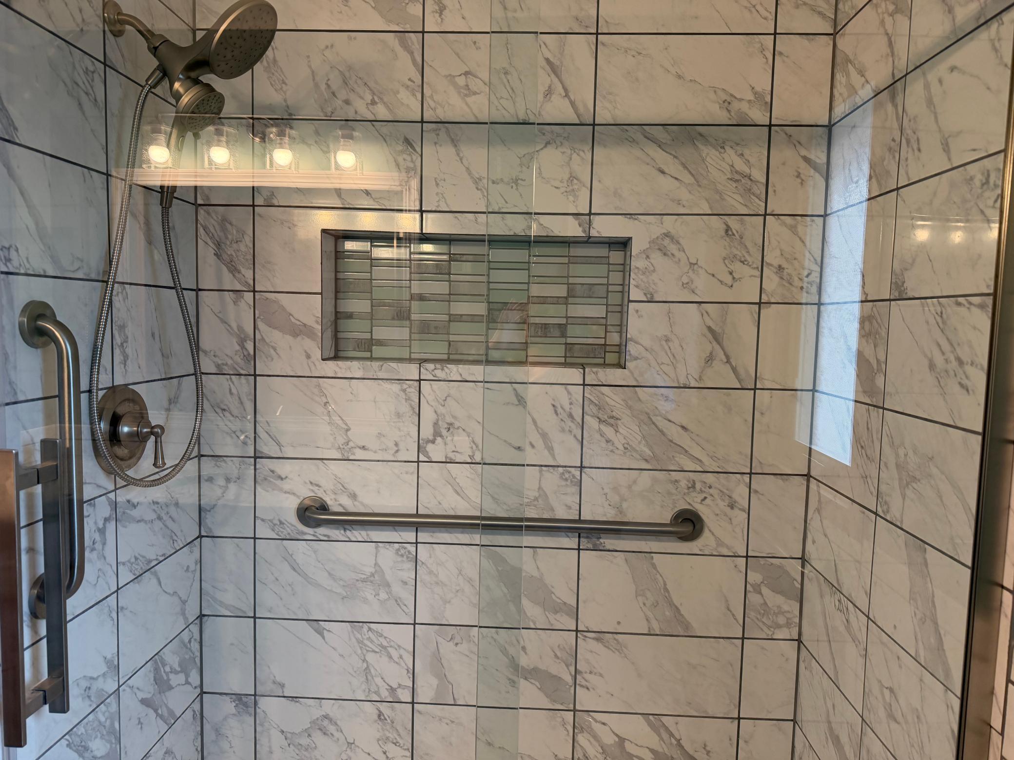 Beautiful Walk in shower with glass doors, niche