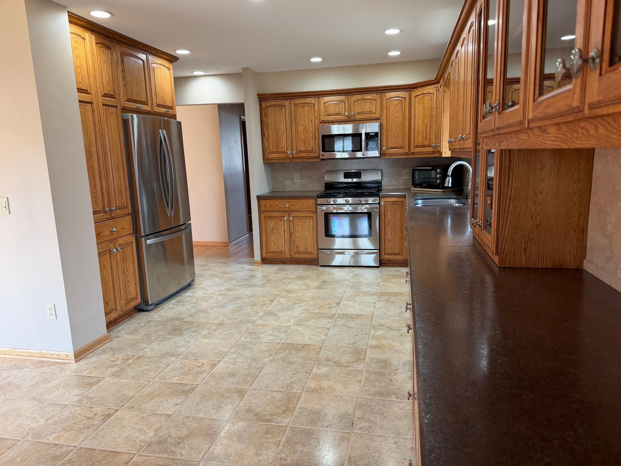 XXL kitchen! Stainless appliances with french door refrigerator and a pantry.