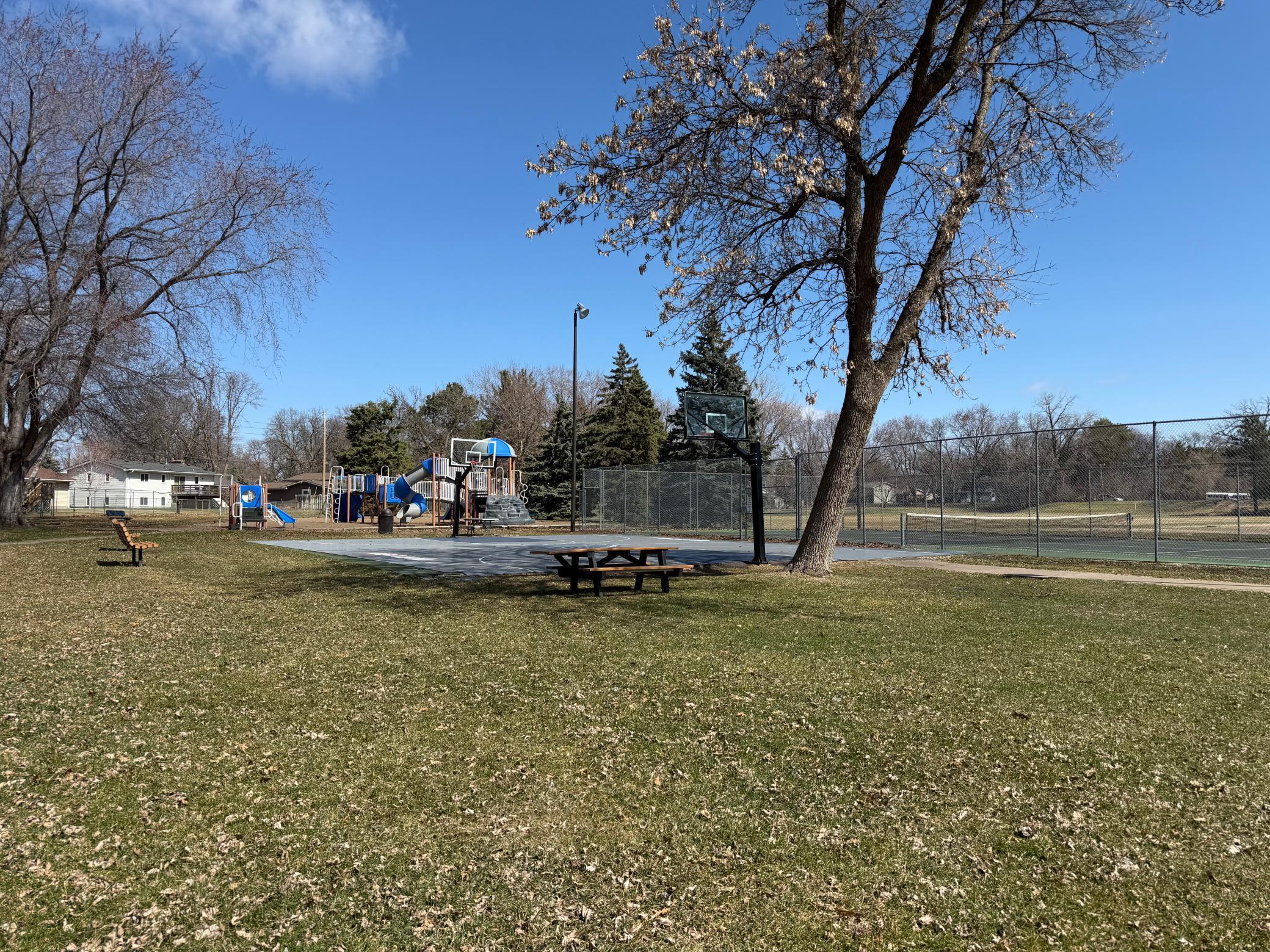 Green space to enjoy walking distance from the house. Lots of benches for seating too.