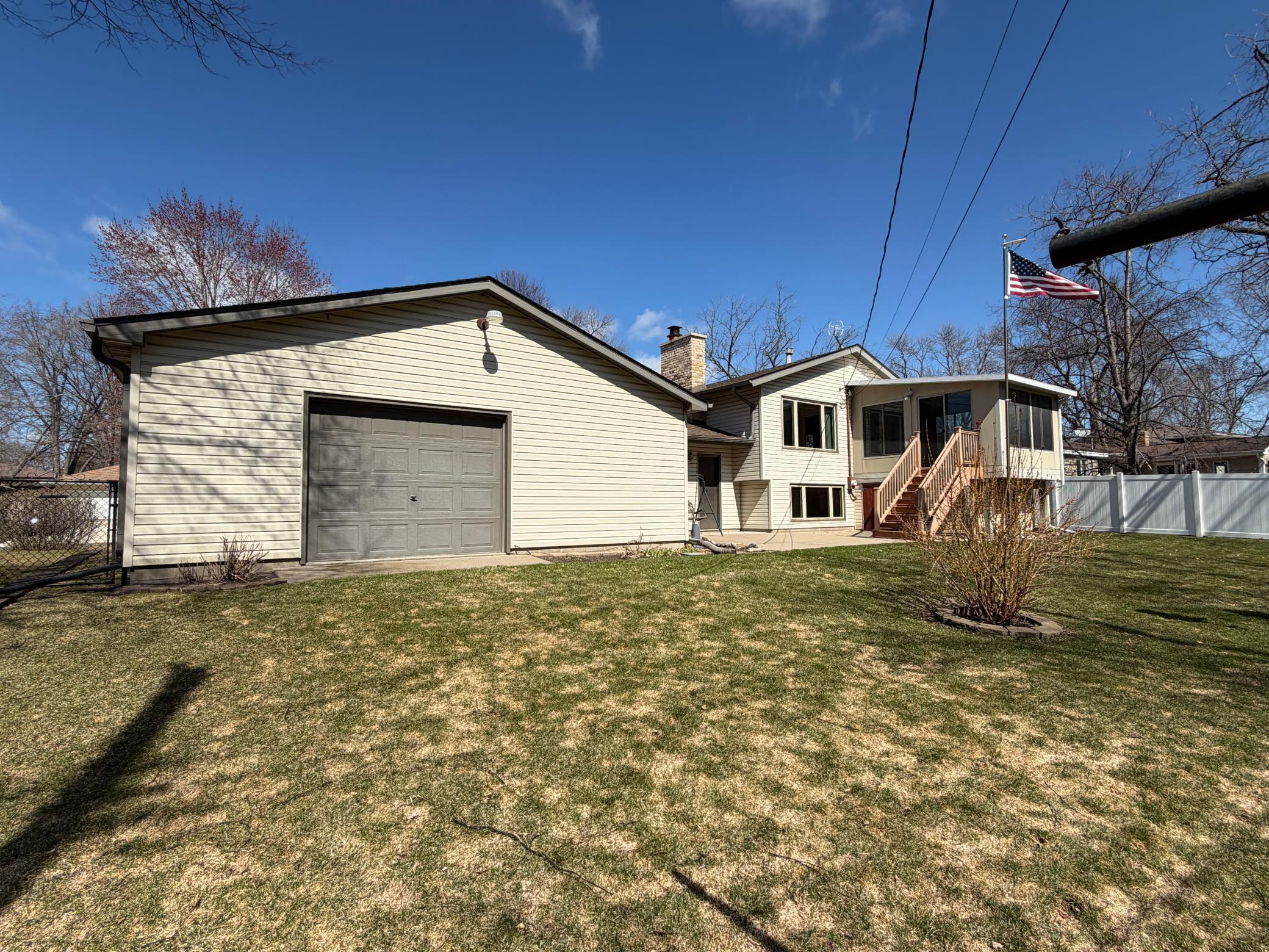 Back of home. Yard has inground sprinkling and the yard is fenced.