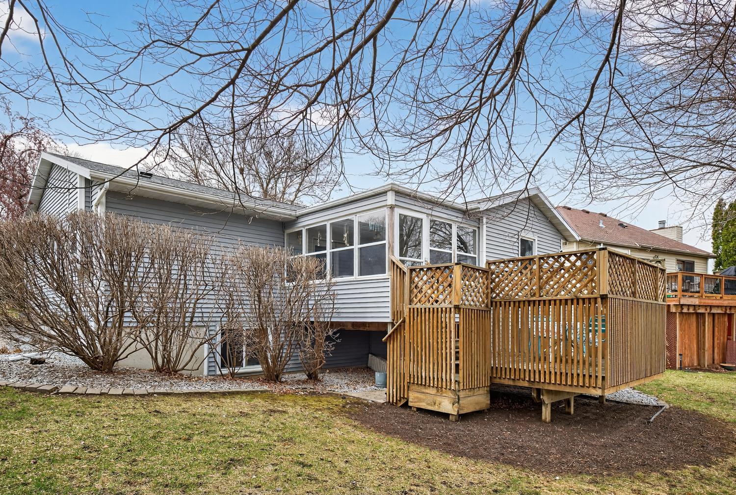 Back of home and multi-tiered deck