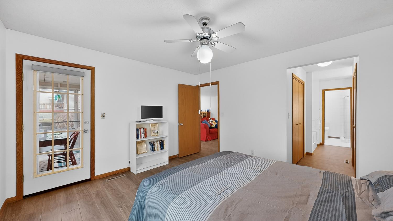 Primary bedroom, door to sunroom/3-season porch