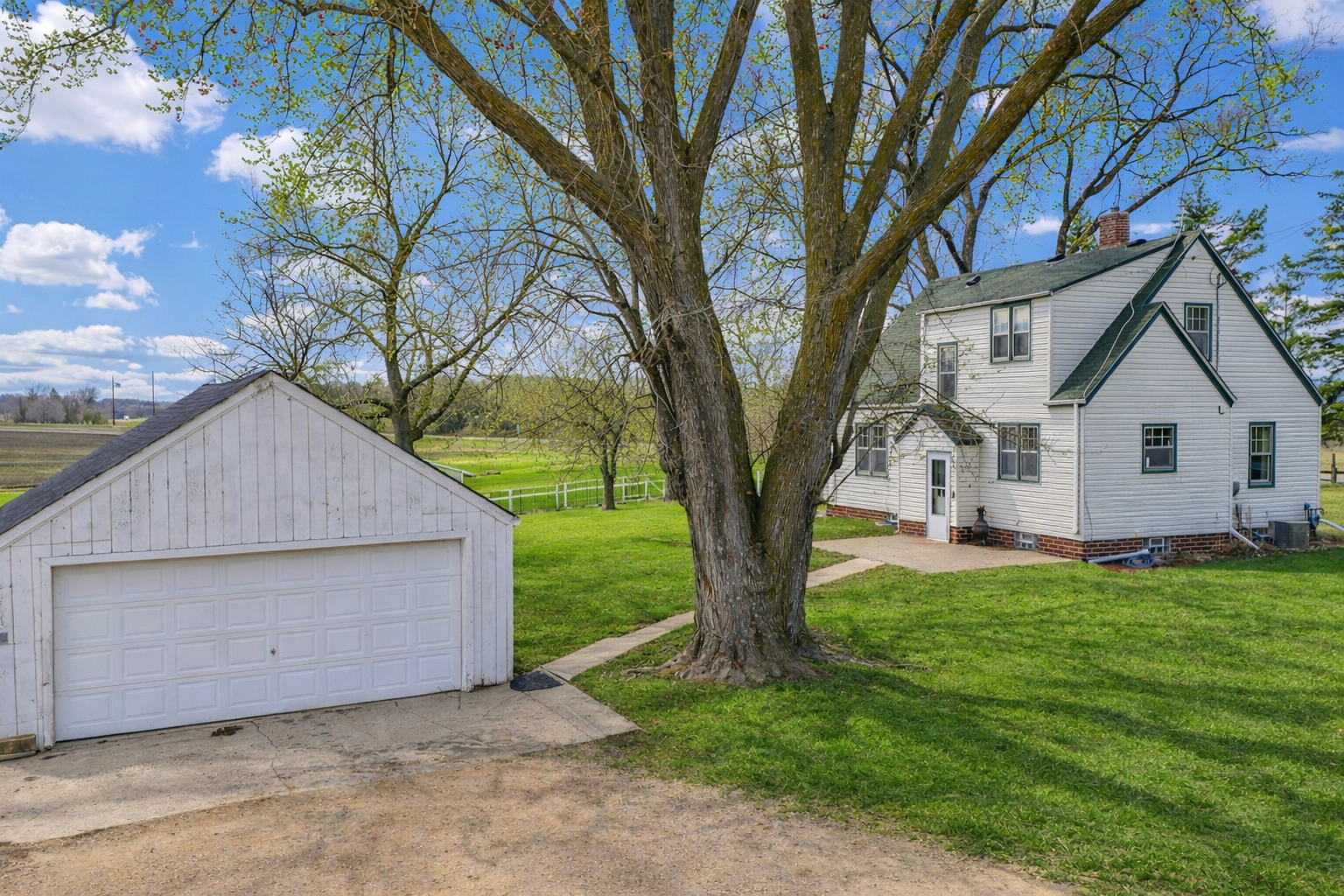Rear Exterior – Garage & Backyard – Peaceful Living, Open Space .png
