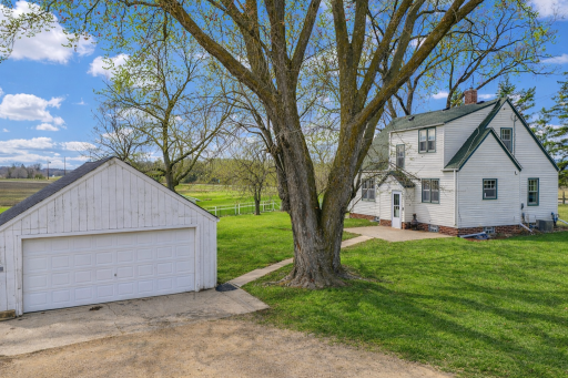 Rear Exterior – Garage & Backyard – Peaceful Living, Open Space .png