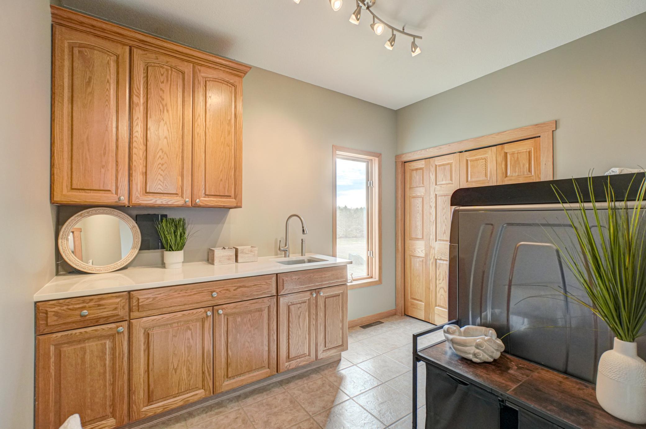 main level laundry / mud room with walk in closet