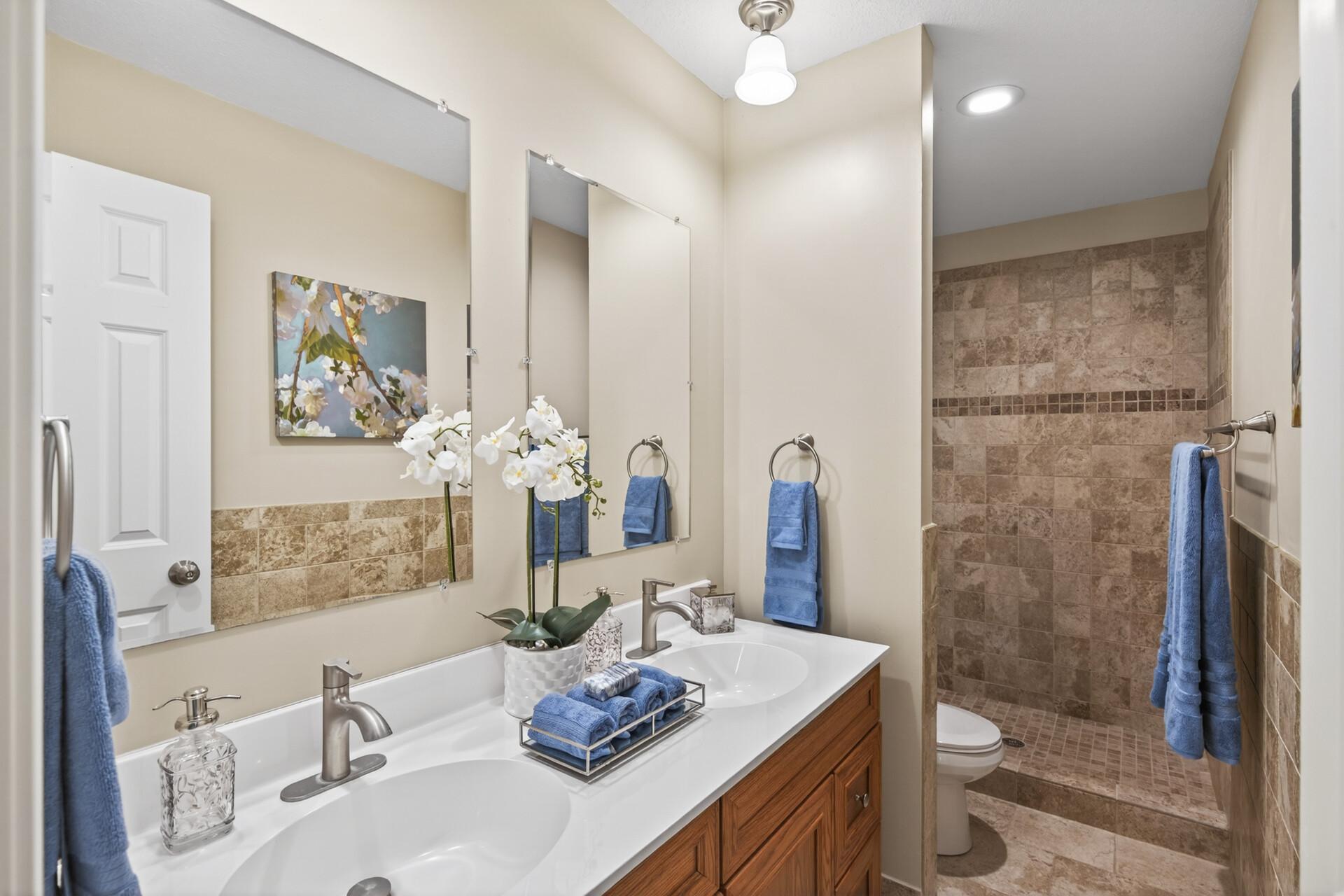 Primary ensuite bathroom with large walk in shower