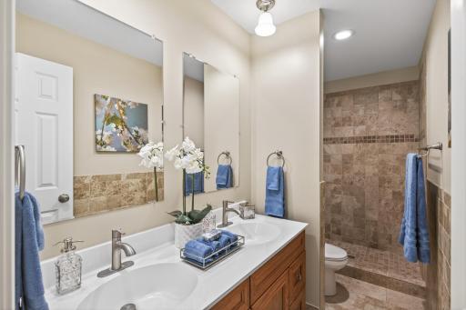Primary ensuite bathroom with large walk in shower
