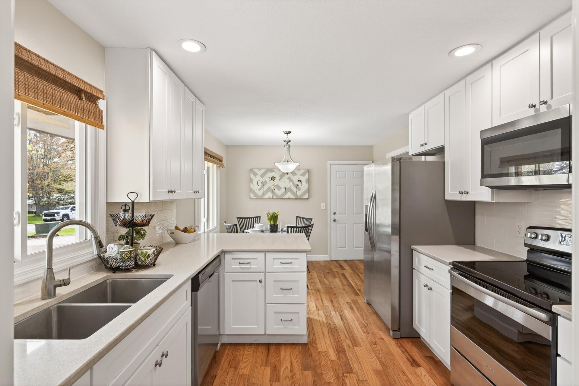 New kitchen cabinets with quartz countertops, updated kitchen appliances